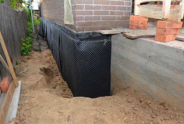 SJ Waterproofing Pros technician performing targeted Waterproofing assessment in Frankenmuth, MI